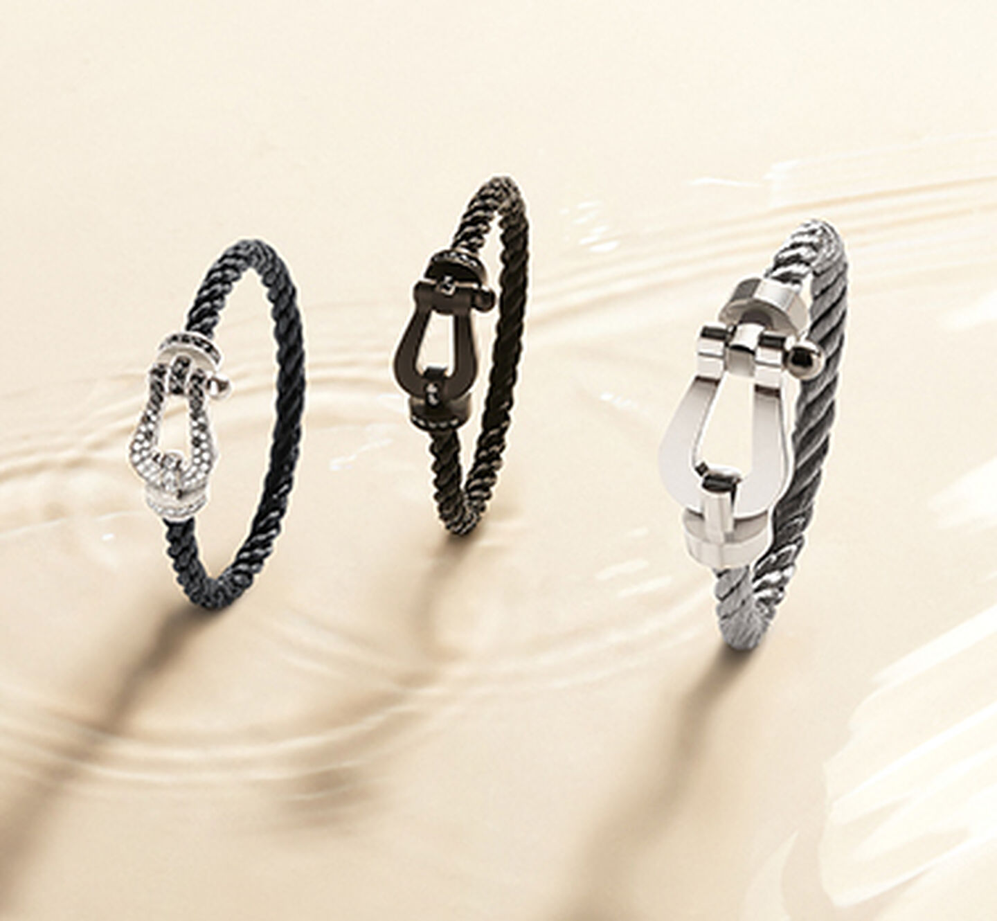 FRED force 10 bracelets on a beige background